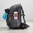 Pink pet water bottle in backpack side pocket hiking