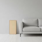 Cat scratching post beside modern sofa space-saving design