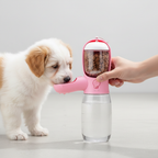 Hand pressing dispenser button small dog drinking water